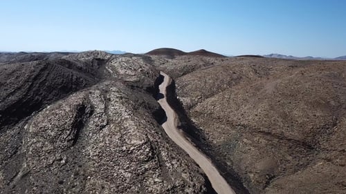 A road in the desert. Sand and outdoor road travel and journey. Freedom for transport and travel.