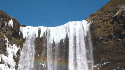 Iceland. Waterfall and Ice. Frozen waterfall in winter, a magical winter landscape. Beautiful nature