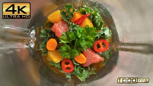 Anti Inflammatory Vitamin Smoothie With Turmeric and Fruit Mixed In A Glass Blender, Top View