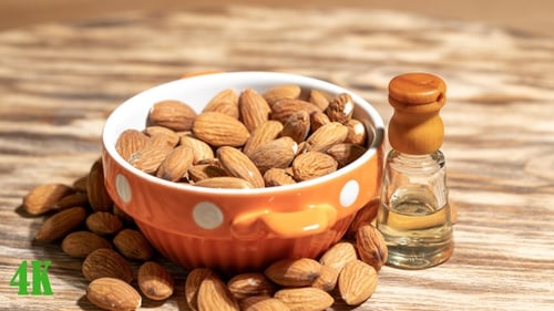Almond Hazelnut. Almond Oil Bottle on a Rotating Platform