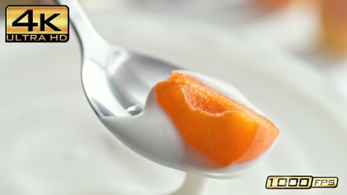 Bright Peach Slice in Yogurt with Silver Spoon