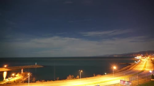 8K Highway Road And Harbor Lights by The Sea at Night