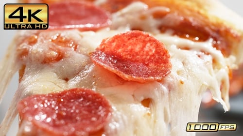 Delicious Slice of Pepperoni Pizza with Melting Cheese
