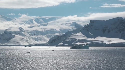 Arctic melting fiord of ice. Global warming. Climate change at Antarctica. Seascape with icebergs.