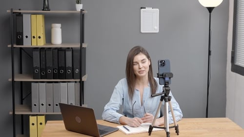 Woman Records Video Blog in Modern Office