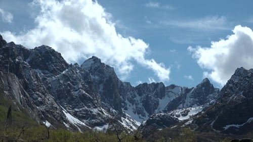 Mountain landscape timelapse moving clouds. Blue sky in the clouds, cloud formation, Norway.