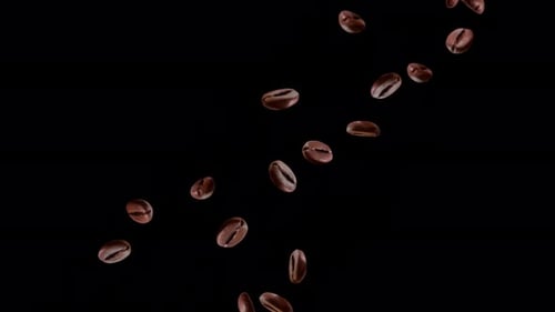 4K Loop flying coffee beans in air isolated on black backdrop slow motion.