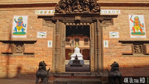 Moving into the doorway entrance to an ancient Buddhist monastery in Bhaktapur, Kathmandu, Nepal