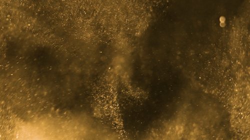 Yellow swirl of sandy dust particles rise up