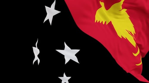 The Papua New Guinea flag with alpha channel waving in the wind in slow motion