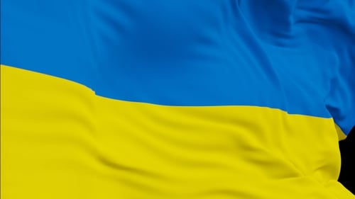 The Ukraine flag with alpha channel waving in the wind in slow motion
