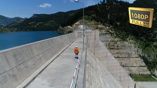 Man Walking On Dam 11