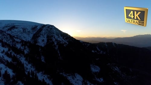Aerial Shot Of Snowy Mountains During Sunrise 2