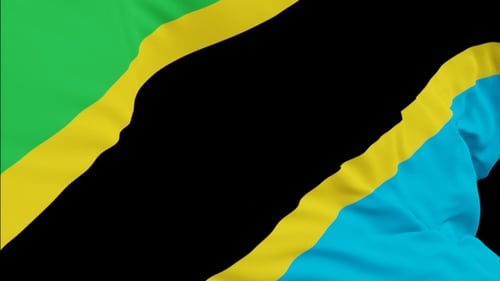 The Tanzania flag with alpha channel waving in the wind in slow motion