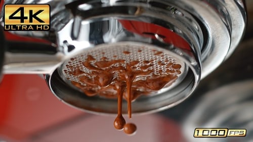 Espresso Pouring from Portafilter Spout in Slow Motion