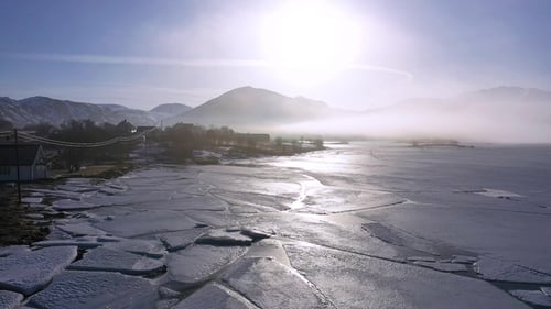 Aerial view of Lofoten island Norway. The winter of village of Reine with snowscape mountain peak.
