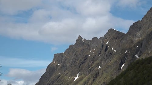 Mountain landscape timelapse moving clouds. Blue sky in the clouds, cloud formation, Norway.