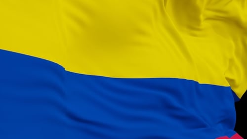 The Colombia flag with alpha channel waving in the wind in slow motion