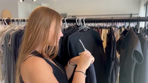 Young Woman Shopping at Clothing Store
