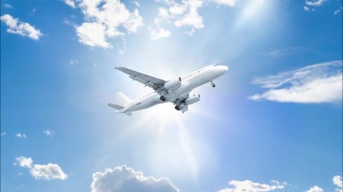 White Passenger Airplane Flying in Blue Sky