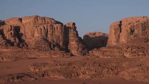 Panorama of mountains in the desert. Sunset, sunrise. Sand hills. Drought. Erosion and geology.