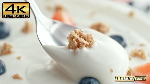 Delicious yogurt with granola, strawberries, and blueberries