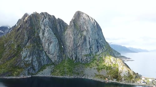 Travel, Norway. View of road to Norway fjord, Lofoten Island mountains, traditional fishing village.