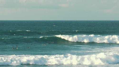 Surfer rides powerful ocean wave on the North Shore of Maui island in Hawaii.