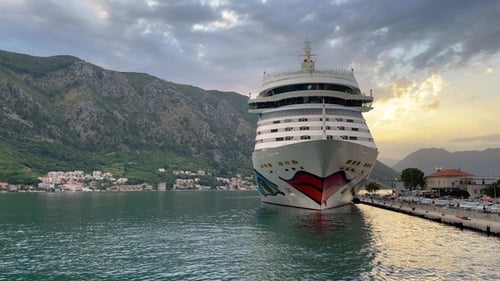 Cruise Ship Navigates Through Majestic Fjord in Norway.