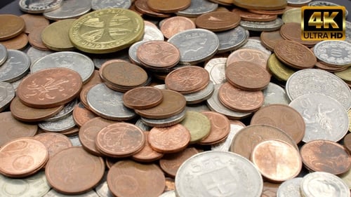 Assorted Coins Fill Frame in a Close Up