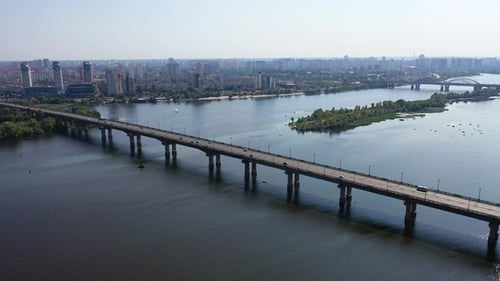 Aerial view of the vehicular intersection, traffic at peak hour with cars on the road, on the bridge