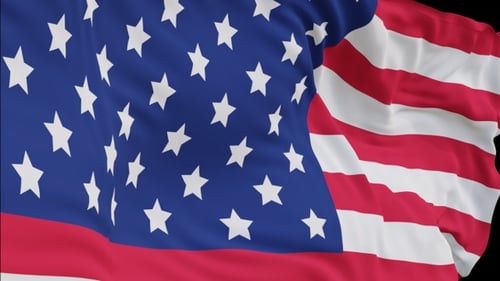 The United States flag with alpha channel waving in the wind in slow motion