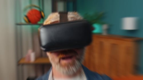Man Using Virtual Reality Headset on Couch
