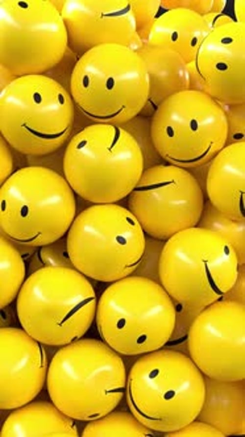 Animated Falling Yellow Smiley Face Balls Background