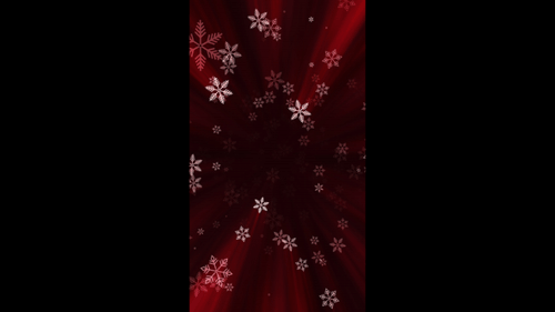 Christmas Snowflakes Falling on Red Vertical Light Rays