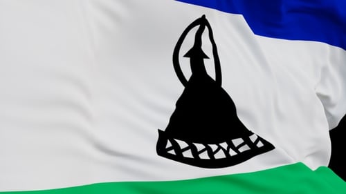 The Lesotho flag with alpha channel waving in the wind in slow motion