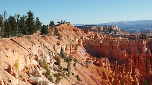 Breathtaking landscapes of Bryce Canyon featuring dramatic red rock formations and towering cliffs.