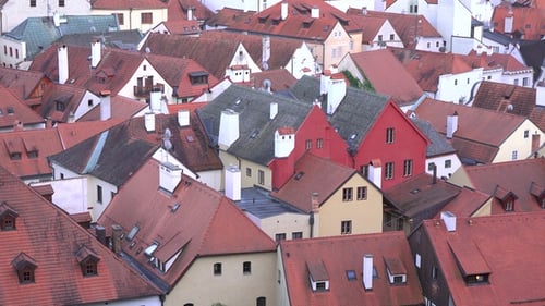 Architecture of a medieval city with a church tower. Panorama of the Czech city Cesky Krumlov.