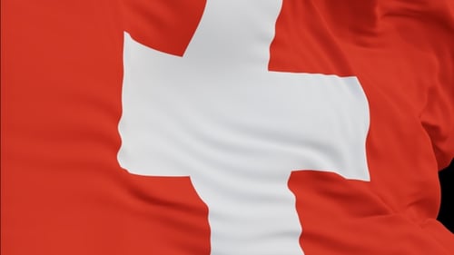 The Switzerland flag with alpha channel waving in the wind in slow motion