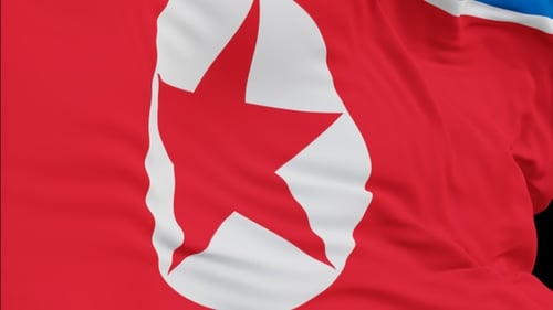 The North Korea flag with alpha channel waving in the wind in slow motion