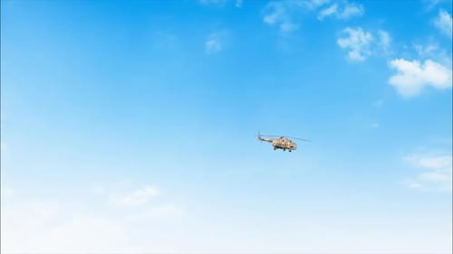 Military Helicopter Flying in Clear Blue Sky