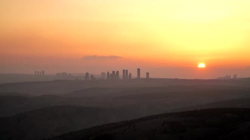 8K Sunset Through City Skyscrapers