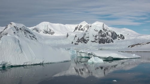 Icy terrain of Antarctica. Unique beauty of nature. Ice formations and snow-covered mountains.