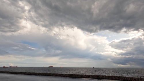 Dramatic sky. The sea, the horizon. Timelapse. Time lapse of fast flying clouds in the sky.