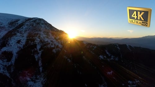 Aerial Shot Of Snowy Mountains During Sunrise 3