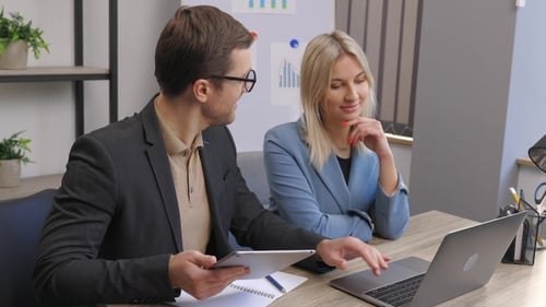 Start up business team on meeting in modern office interior, working on laptop and tablet