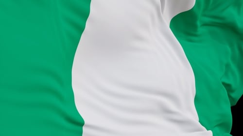 The Nigeria flag with alpha channel waving in the wind in slow motion