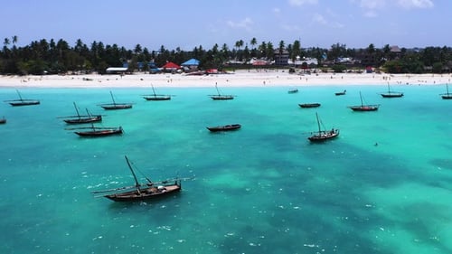 Sunny beach with white sand and turquoise waters. Beach panorama aerial view. Tropical beach.
