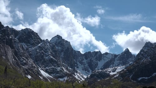 Mountain landscape timelapse moving clouds. Blue sky in the clouds, cloud formation, Norway.