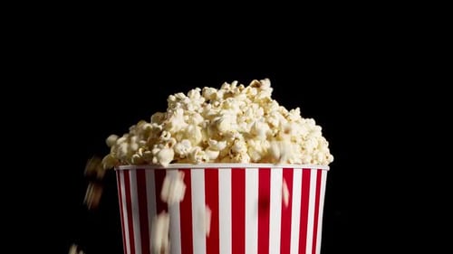 Popcorn Overflowing Red and White Striped Bucket